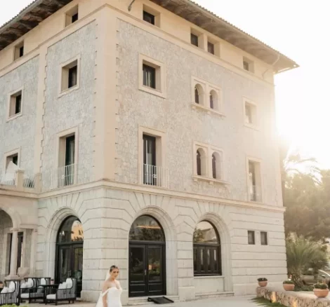 Image of bride standing in front of wedding venue Hospes Maricel & Spa, Mallorca
