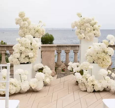 Flowers at end of aisle at wedding venue Hospes Maricel & Spa, Mallorca