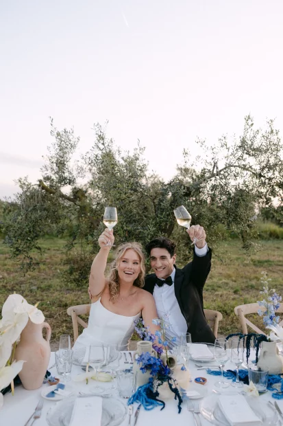 Image of married couple sat at dinner table at wedding venue Finca La Concertista, Spain