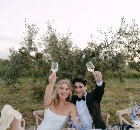 Image of married couple sat at dinner table at wedding venue Finca La Concertista, Spain