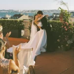 Image of married couple at end of aisle with a view of lisbon at wedding venue Palácio Tancos in Lisbon, Portugal