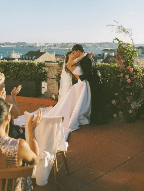 Image of married couple at end of aisle with a view of lisbon at wedding venue Palácio Tancos in Lisbon, Portugal