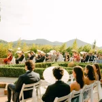 Guests sat on wedding aisle at wedding venue Mas de Sant Lleí, Barcelona