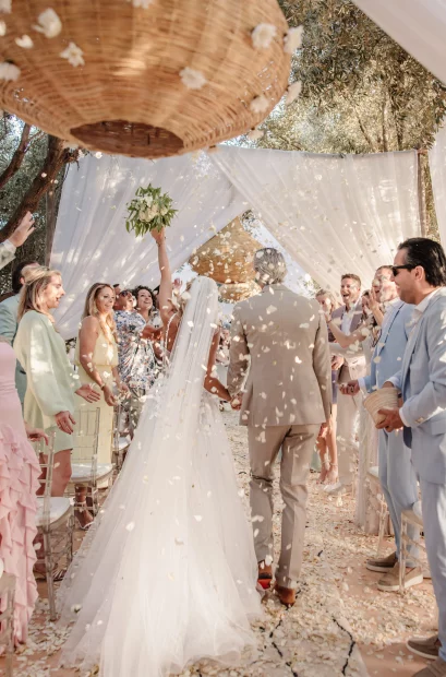 Image of bride and groom walking down aisle after ceremony