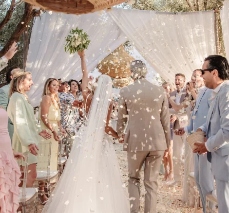 Image of bride and groom walking down aisle after ceremony