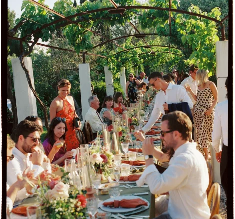Image of wedding guests sat at dining table at wedding venue Tenuta Negroamaro, Italy