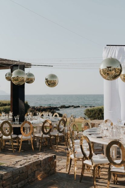 Wedding tables with sea views at wedding venue in Crete, Amirandes - a Grecotel property