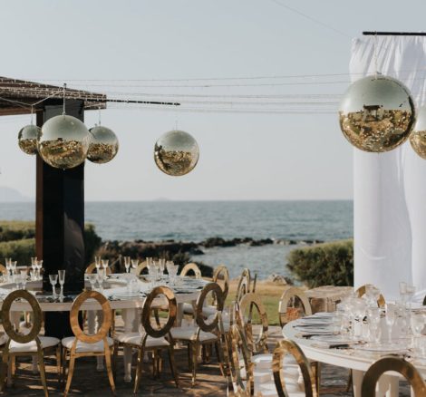Wedding tables with sea views at wedding venue in Crete, Amirandes - a Grecotel property