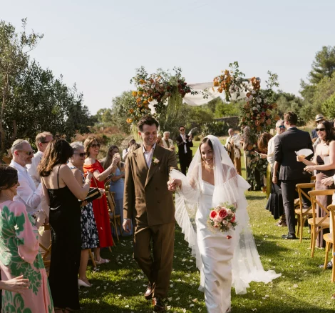 Image of couple walking down aisle at wedding venue Tenuta Negroamaro in Puglia, Italy