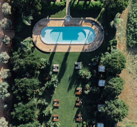 Drone shot of pool and gardens at wedding venue Image Courtesy of Vestige Son Vell, Spain